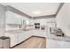Well-maintained kitchen boasts white cabinets, updated countertops, and modern lighting at 5208 30Th W St, Bradenton, FL 34207