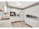 Bright kitchen featuring white cabinetry, modern appliances, and sleek countertops at 5208 30Th W St, Bradenton, FL 34207