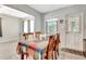 Cozy eat-in kitchen with bright light, table with chairs, and white door at 5208 30Th W St, Bradenton, FL 34207
