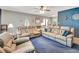 Comfortable living room with plush sofas, a ceiling fan, and neutral tones for a cozy ambiance at 5208 30Th W St, Bradenton, FL 34207