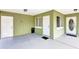 Covered porch with multiple entryways and ample space, providing shelter and convenience at 5208 30Th W St, Bradenton, FL 34207