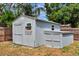 Exterior view of backyard shed, ideal for storage or hobbies, enhancing the functionality of the outdoor space at 5208 30Th W St, Bradenton, FL 34207