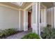 Inviting front door with decorative columns and a well-maintained entryway at 8035 St Simons St # 8035, University Park, FL 34201