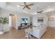 Bright living room featuring modern decor, stylish furniture, hardwood floors and neutral colored walls at 8035 St Simons St # 8035, University Park, FL 34201