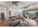 Open concept living space with an island, stainless steel appliances, breakfast bar, and hardwood floors at 8035 St Simons St # 8035, University Park, FL 34201