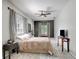 This bedroom has an accent wall, ceiling fan, and plush carpeting at 20003 Holly Lake Pl, Lutz, FL 33558