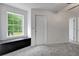 This carpeted room features a window seat for storage at 20003 Holly Lake Pl, Lutz, FL 33558