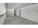 A spacious bonus room features neutral carpeting, white walls, and recessed lighting, offering a versatile living area at 20003 Holly Lake Pl, Lutz, FL 33558