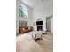 Inviting living room with soaring ceilings, large windows, modern furniture, and lots of natural light at 20003 Holly Lake Pl, Lutz, FL 33558