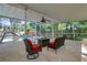 This screened patio overlooks the pool and play area at 20003 Holly Lake Pl, Lutz, FL 33558