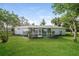 Spacious backyard featuring a screened in porch at 10237 Bannock St, Spring Hill, FL 34608
