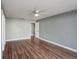 Bedroom showcasing a ceiling fan, light gray walls, and wood floors at 10237 Bannock St, Spring Hill, FL 34608