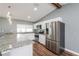 Well-equipped kitchen with stainless steel appliances, granite countertops, and ample cabinet space at 10237 Bannock St, Spring Hill, FL 34608