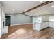 Spacious living area flows into the kitchen with wood floors and natural light at 10237 Bannock St, Spring Hill, FL 34608