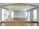 Expansive living room featuring vaulted ceilings and wood flooring providing lots of space at 10237 Bannock St, Spring Hill, FL 34608