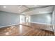 Bright living room with vaulted ceilings and hardwood floors for an open and airy feel at 10237 Bannock St, Spring Hill, FL 34608