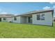 Expansive backyard featuring a covered patio and lush lawn, perfect for outdoor enjoyment at 13839 Richland Gulf Cir, Parrish, FL 34219