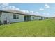 New homes feature bright green lawns and neutral colored exteriors at 13839 Richland Gulf Cir, Parrish, FL 34219
