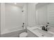 Bathroom featuring modern sink, white tiled bathtub, and black fixtures at 13839 Richland Gulf Cir, Parrish, FL 34219