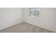 Neutral bedroom with plush carpeting and a bright window at 13839 Richland Gulf Cir, Parrish, FL 34219