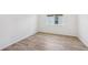 Bedroom featuring wood-look flooring and bright natural light at 13839 Richland Gulf Cir, Parrish, FL 34219