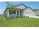 Well-manicured lawn and landscaping highlight this charming single Gathering home at 13839 Richland Gulf Cir, Parrish, FL 34219