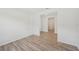 Room featuring wood-look flooring and bright neutral paint at 13839 Richland Gulf Cir, Parrish, FL 34219
