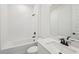 Bathroom showcasing a tub, sleek vanity, toilet, mirror, and fixtures at 14035 Kelly Park Ct, Parrish, FL 34219
