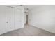 Bedroom with neutral carpet, closet, and doors to other rooms at 14035 Kelly Park Ct, Parrish, FL 34219
