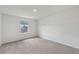Bedroom features neutral carpet, white walls, and a window at 14035 Kelly Park Ct, Parrish, FL 34219