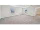 Large bonus room featuring neutral carpeting, windows and light walls at 14035 Kelly Park Ct, Parrish, FL 34219