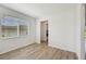 Flex room boasts wood-look tile flooring and access to other rooms at 14035 Kelly Park Ct, Parrish, FL 34219