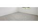 Bedroom showcasing neutral carpet and ample natural light from the window at 7736 Gilchrist Springs Dr, Parrish, FL 34219