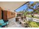 Charming home exterior features a cozy porch area and manicured landscaping, enhancing its inviting curb appeal at 8390 40Th N Ave, St Petersburg, FL 33709