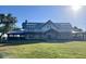 A well maintained and landscaped community clubhouse featuring a large front lawn and covered porch at 42854 Park View Dr Way, Punta Gorda, FL 33982