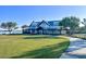 A large building with a covered porch area in a well maintained community near a body of water at 42854 Park View Dr Way, Punta Gorda, FL 33982