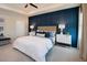 Inviting bedroom with a feature wall, plush bedding, and coordinated nightstands at 42854 Park View Dr Way, Punta Gorda, FL 33982