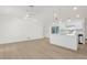 Open-concept living room with sleek flooring, modern lighting fixtures, and updated interior at 4284 Persian Ln, North Port, FL 34287