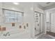 Bathroom with garden tub, shower and a window to allow natural light at 6731 Northlake Dr, Zephyrhills, FL 33542