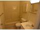 Compact full bathroom with tub and shower, updated vanity and fixtures at 8440 Old Post Rd # 202, Port Richey, FL 34668