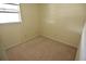 Small bedroom with light carpet and neutral paint at 8440 Old Post Rd # 202, Port Richey, FL 34668
