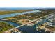Overhead view highlighting a waterfront home, close to a bridge, with private dock along a canal at 9277 St Paul Dr, Port Charlotte, FL 33981