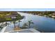 Aerial view of backyard featuring the dock and canal access at 9277 St Paul Dr, Port Charlotte, FL 33981