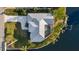 Waterfront home features private pool, dock, and lush landscaping at 9277 St Paul Dr, Port Charlotte, FL 33981