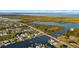 Breathtaking aerial view of waterfront homes on canals leading to a bay with lush natural surroundings at 9277 St Paul Dr, Port Charlotte, FL 33981