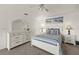 Inviting bedroom with a stylish bed, dresser, and beach-themed artwork at 9277 St Paul Dr, Port Charlotte, FL 33981