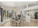 Bright dining area featuring waterfront views and stylish furniture at 9277 St Paul Dr, Port Charlotte, FL 33981