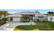 Charming waterfront home with metal roof, lush landscaping, and canal views at 9277 St Paul Dr, Port Charlotte, FL 33981