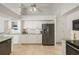 Spacious kitchen featuring white cabinetry, modern appliances, and stylish tile flooring at 9277 St Paul Dr, Port Charlotte, FL 33981
