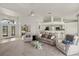 Spacious living room with high ceilings, plenty of seating, and natural light at 9277 St Paul Dr, Port Charlotte, FL 33981